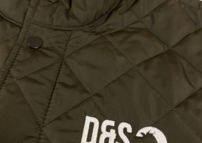 White embroidery to black jacket